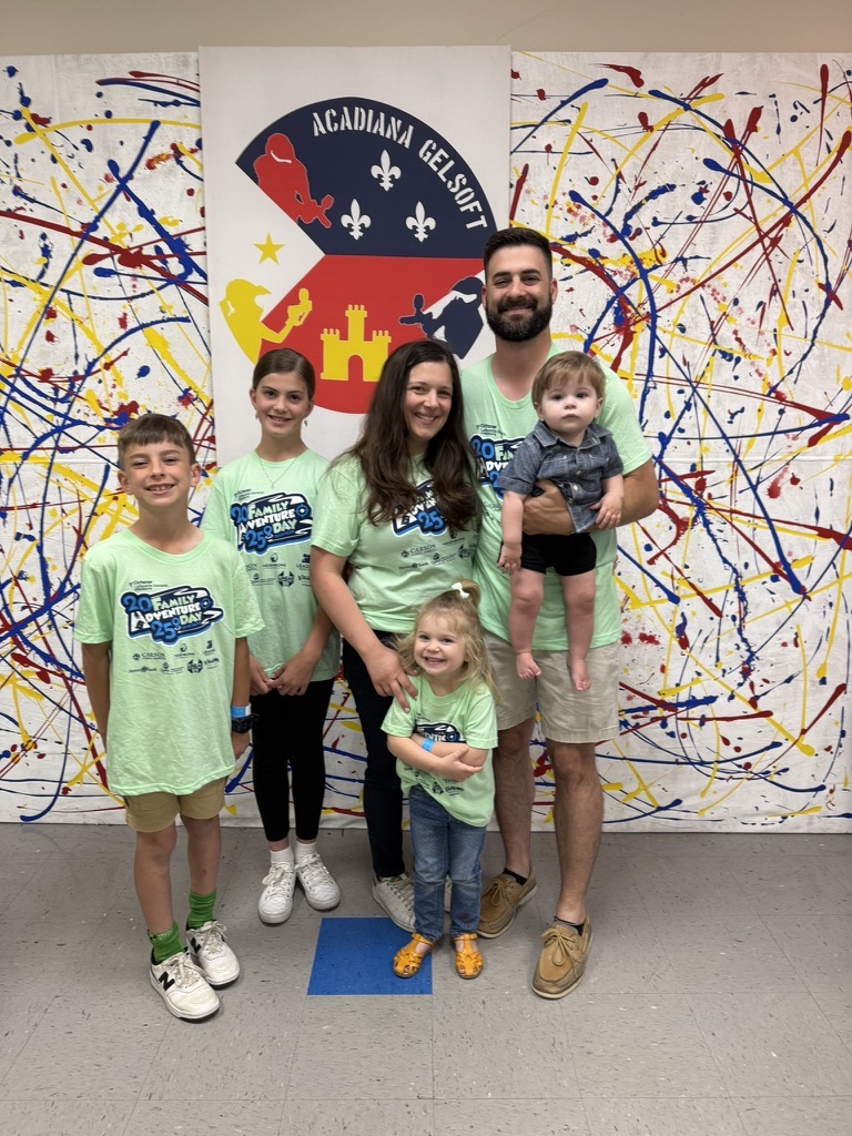 Mitchell and Elizabeth Hebert with their four children